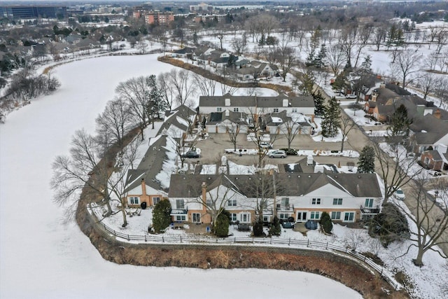 snowy aerial view featuring a residential view