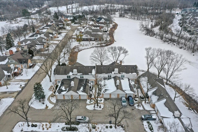 snowy aerial view with a residential view