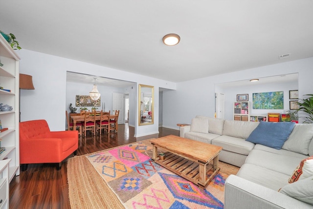 living area with wood finished floors and visible vents