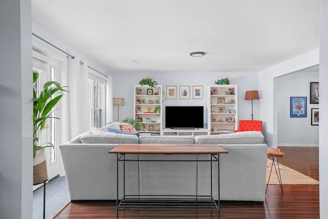 living area featuring dark wood-style flooring