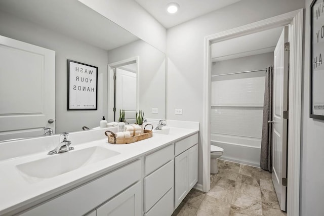 bathroom featuring double vanity, shower / bathtub combination with curtain, toilet, and a sink