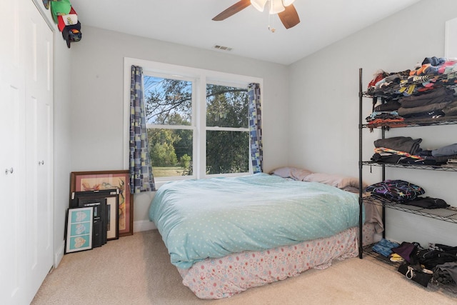 bedroom featuring visible vents, carpet, and ceiling fan