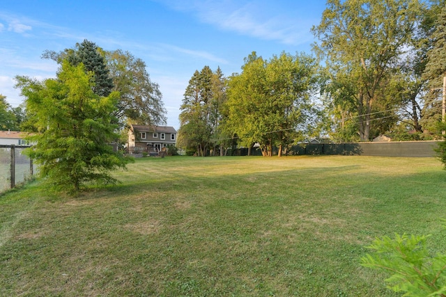 view of yard with fence