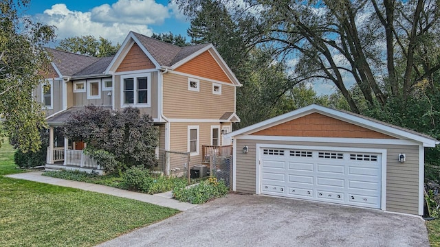 571 Winthrop Ave, Glendale Heights, IL 60139 - craftsman inspired home featuring a front lawn, a garage, an outdoor structure, cooling unit, and roof with shingles