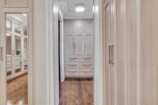 interior space with dark wood finished floors and ornamental molding