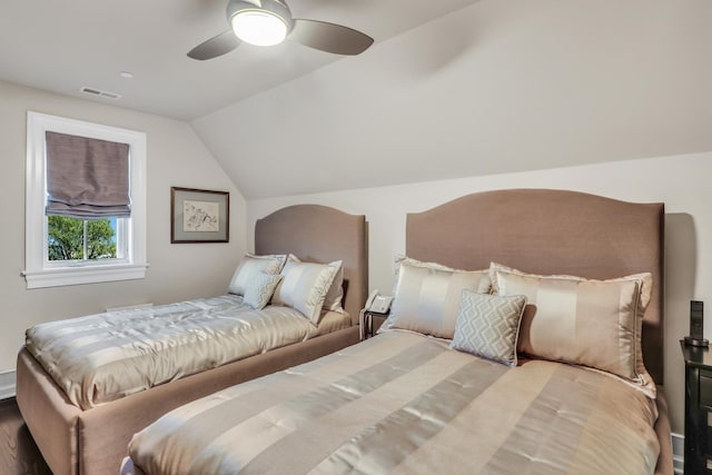 bedroom featuring visible vents, ceiling fan, and vaulted ceiling