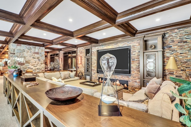 interior space featuring a large fireplace, crown molding, carpet floors, beam ceiling, and coffered ceiling