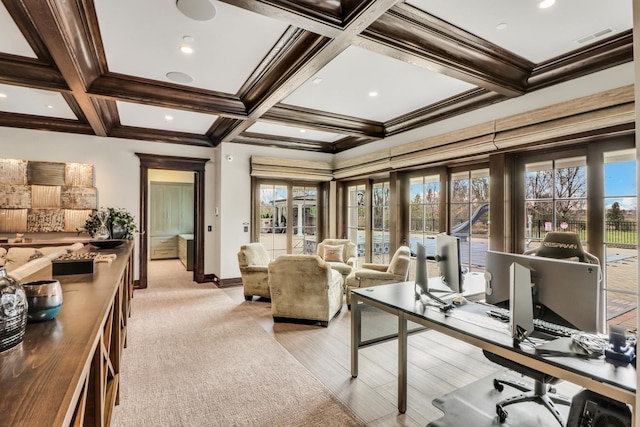 office with visible vents, coffered ceiling, a healthy amount of sunlight, and beamed ceiling