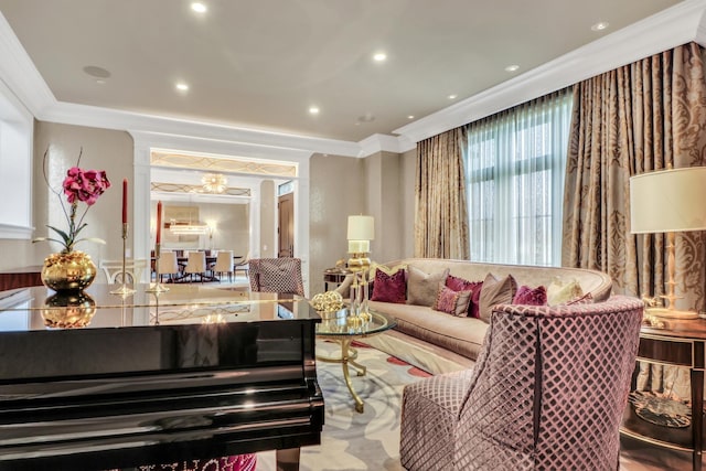 living area with recessed lighting and crown molding