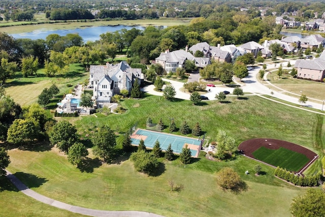 birds eye view of property featuring a residential view and a water view