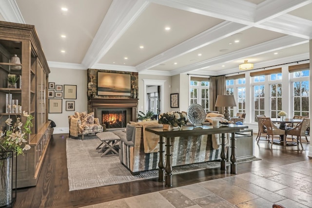 living area featuring recessed lighting, beam ceiling, a fireplace, and crown molding