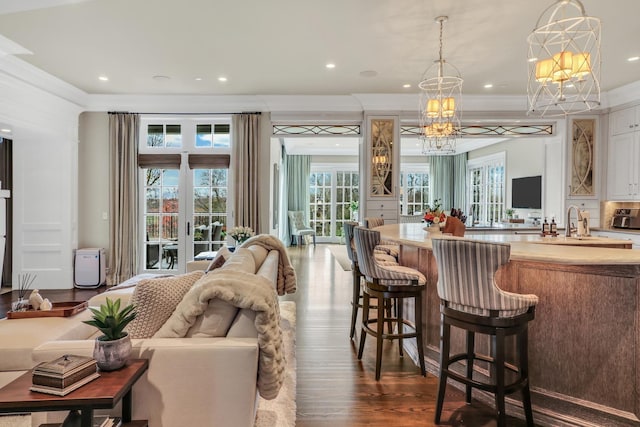 bar featuring a wealth of natural light, dark wood-style floors, french doors, and crown molding