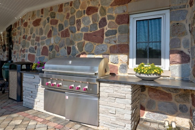 view of patio / terrace featuring grilling area and an outdoor kitchen