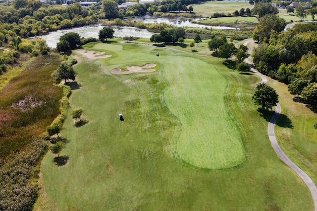 bird's eye view with a water view and golf course view