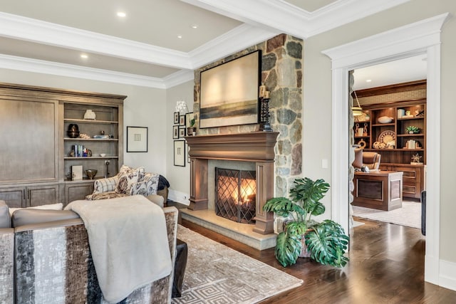 interior space featuring recessed lighting, a large fireplace, wood finished floors, and crown molding