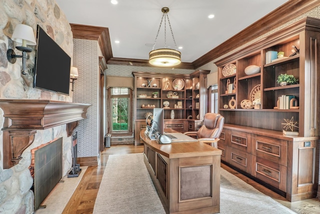 office area featuring light wood-type flooring, a high end fireplace, recessed lighting, crown molding, and wallpapered walls