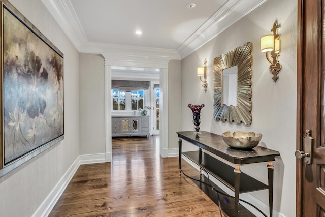 corridor featuring dark wood-type flooring, baseboards, and ornamental molding