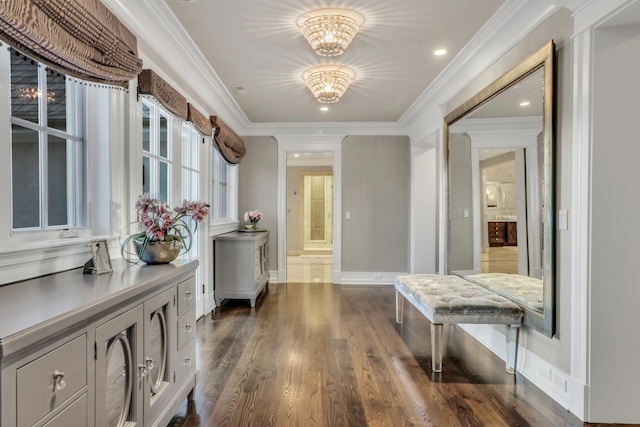 interior space with baseboards, dark wood finished floors, recessed lighting, ornamental molding, and a chandelier