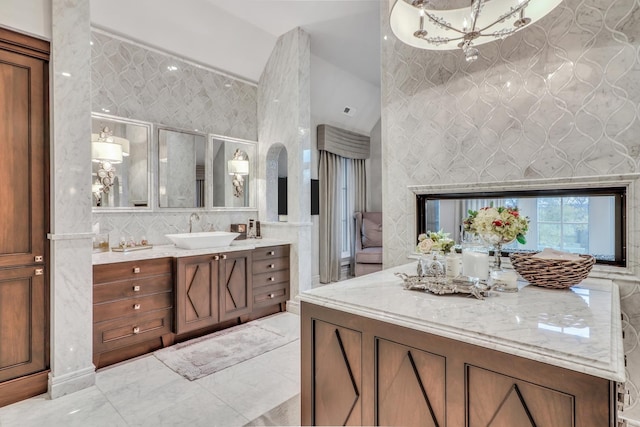 bathroom with vanity and vaulted ceiling