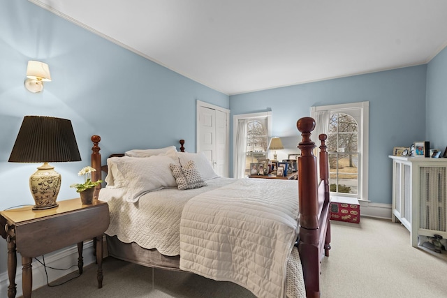 carpeted bedroom with a closet