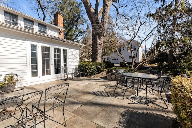 view of patio with outdoor dining space and french doors