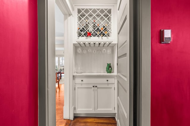 bar featuring dark wood finished floors