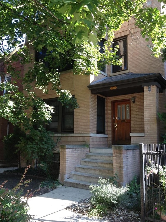 entrance to property with brick siding