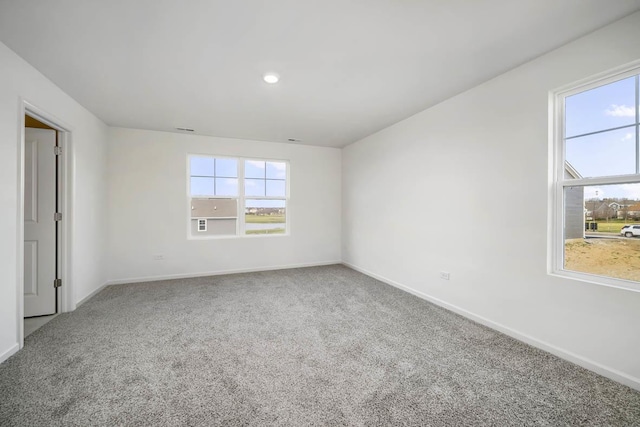 empty room with baseboards and carpet floors