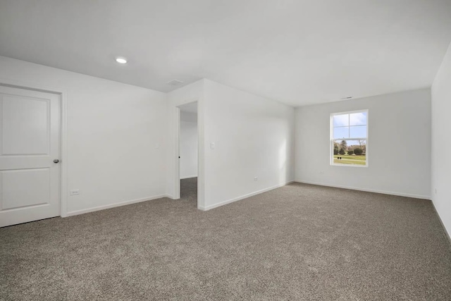 unfurnished room featuring recessed lighting, carpet, and baseboards