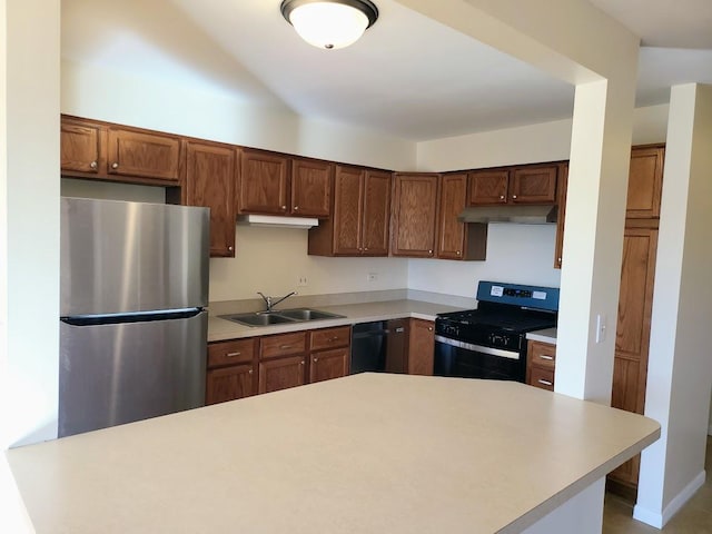 kitchen with a sink, black appliances, light countertops, and under cabinet range hood