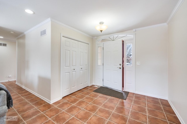 tiled foyer entrance featuring recessed lighting, visible vents, baseboards, and ornamental molding