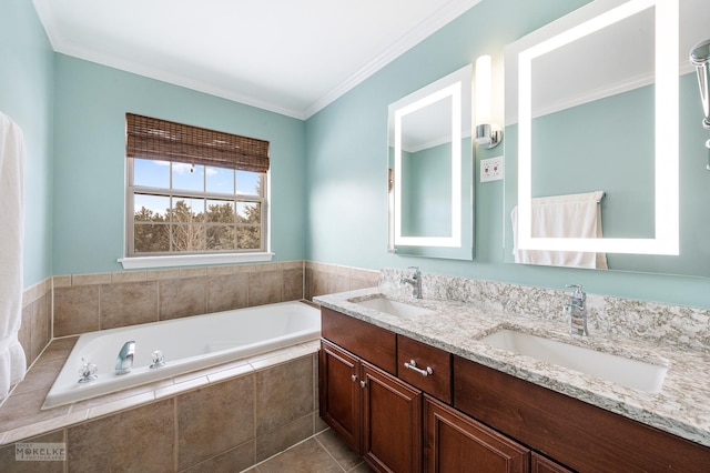 full bath featuring a sink, a garden tub, ornamental molding, and double vanity