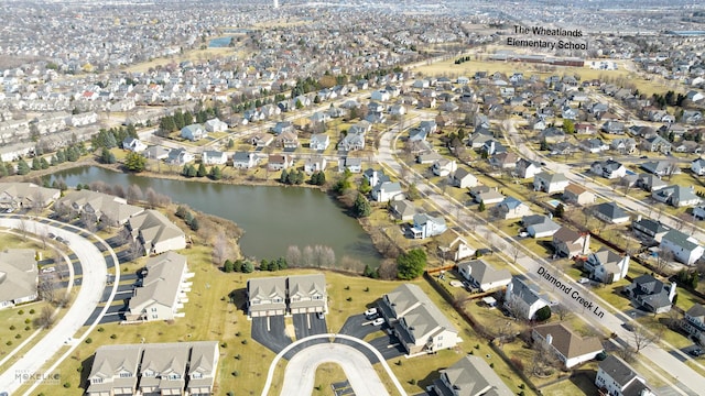 bird's eye view featuring a residential view and a water view