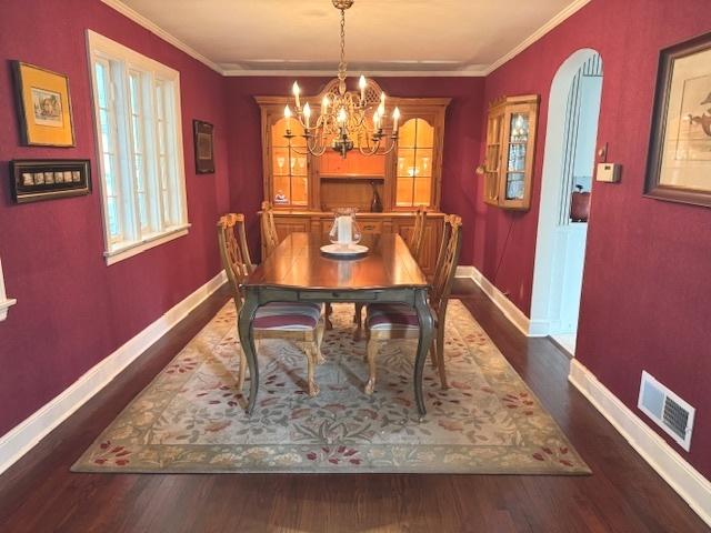 2007 Amherst Ct, Flossmoor, IL 60422 - dining area with baseboards, wood finished floors, ornamental molding, and a chandelier