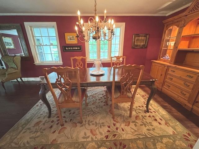 2007 Amherst Ct, Flossmoor, IL 60422 - dining room featuring wood finished floors, a chandelier, baseboards, and crown molding