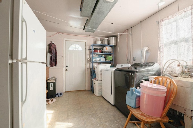laundry room featuring washer and dryer, laundry area, and light floors