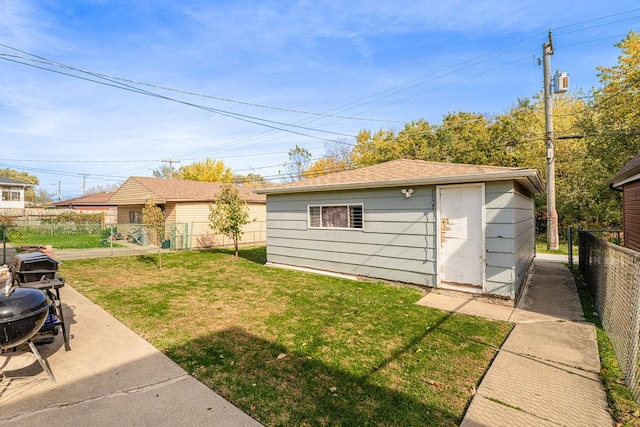 exterior space with an outbuilding and a fenced backyard