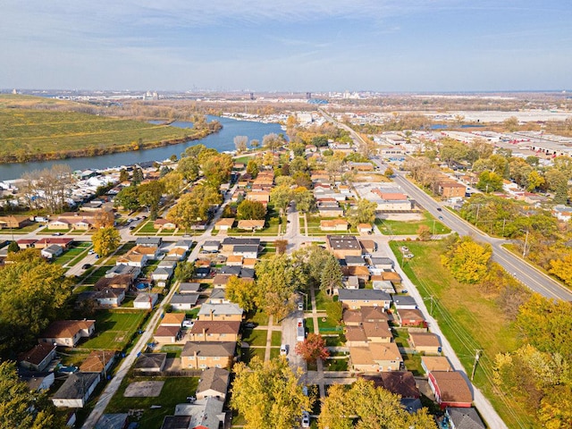 drone / aerial view featuring a residential view and a water view