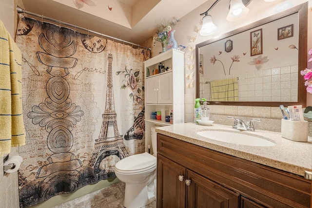 bathroom featuring a shower with curtain, toilet, and vanity