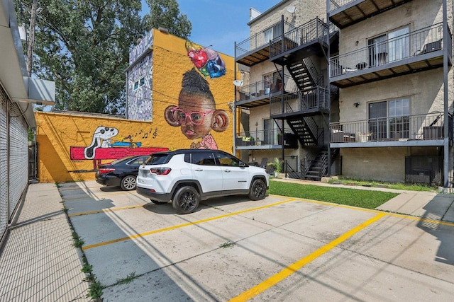 uncovered parking lot featuring stairs