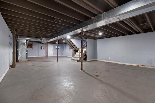 finished basement featuring stairway, baseboards, and visible vents