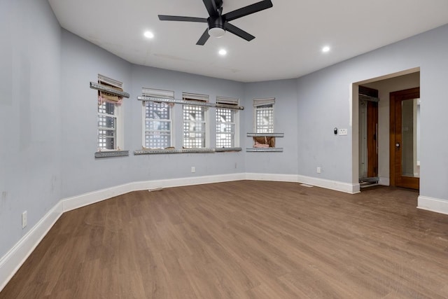 unfurnished room with recessed lighting, baseboards, wood finished floors, and ceiling fan