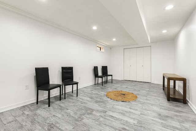 sitting room featuring recessed lighting, baseboards, and wood finished floors