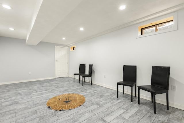 living area featuring recessed lighting, baseboards, and wood finished floors