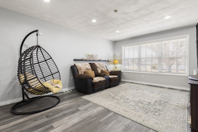 sitting room with recessed lighting, baseboards, and wood finished floors