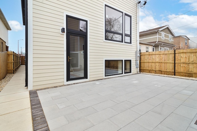 view of patio featuring fence