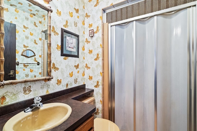 8328 Latrobe Ave, Burbank, IL 60459 - bathroom featuring toilet, vanity, and wallpapered walls