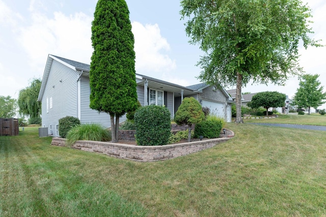 view of property exterior with a garage and a lawn