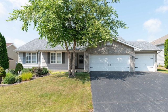 ranch-style house with a garage, roof with shingles, a front lawn, and aphalt driveway