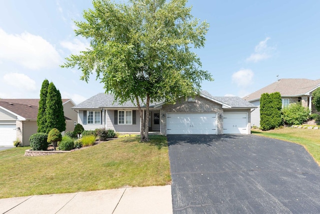 single story home with aphalt driveway, a front yard, and a garage